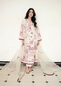 A woman modeling a traditional three-piece salwar kameez suit in off-white with pink floral embroidery, featuring a matching sheer dupatta, set against a textured white wall and a black-and-white checkered floor.